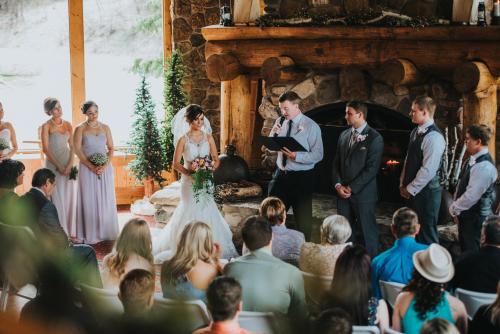 a bride and groom walking down the aisle at their wedding ceremony at Spearfish Canyon Lodge in Spearfish