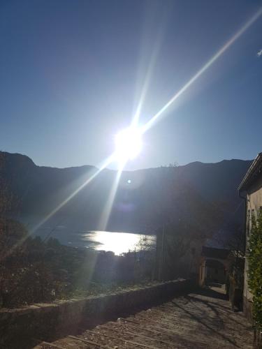 a view of the sun setting over a river at Domus Alba Lenno in Lenno
