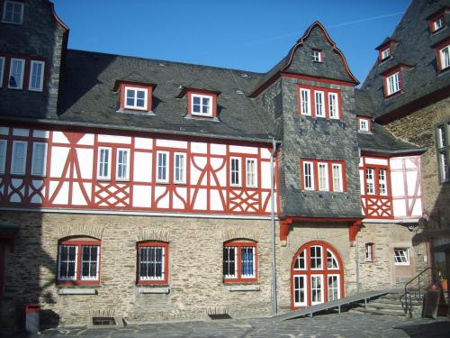 an old building with red and white at Schau-Rhein#2 - on Top of Bacharach, Rhineview in Bacharach