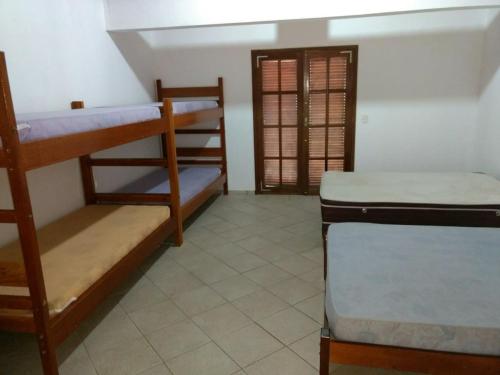 Una cama o camas en una habitación de Pousada Familiar Morada do Rapha