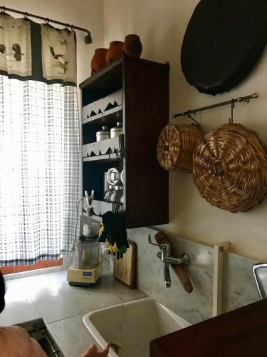 a kitchen with a sink and a counter top at Villa Sara di Puglia in Castellaneta