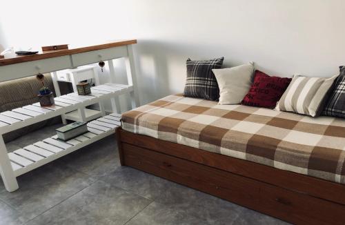 A bed or beds in a room at Departamento en Olavarría