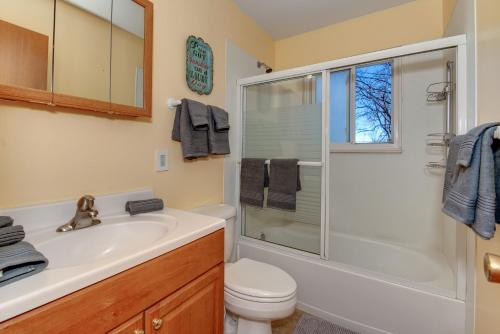 a bathroom with a toilet sink and a shower at Pet Friendly Sleeps 12 near Garden of the Gods AF in Colorado Springs