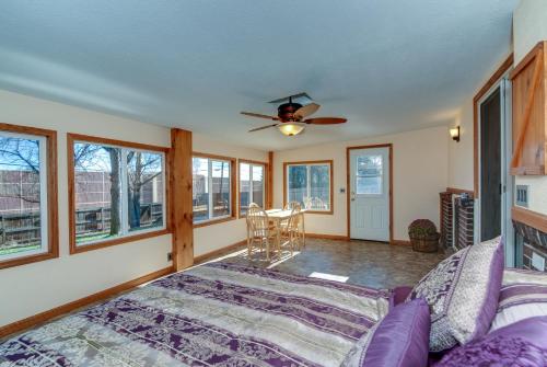 a living room with a ceiling fan and a couch at Pet Friendly Sleeps 12 near Garden of the Gods AF in Colorado Springs