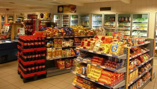 
a grocery store filled with lots of fresh produce at Dovre Motel in Dovre
