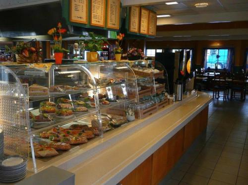 a buffet line with many different types of food at Dovre Motell in Dovre