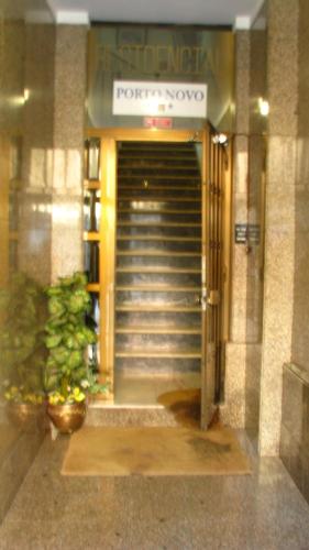 a entrance to a building with a door and stairs at Residencial Porto Novo - Alojamento Local in Porto