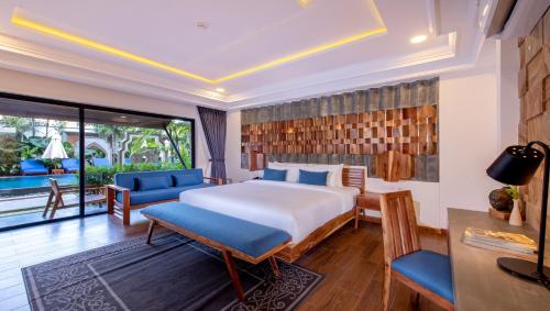 a hotel room with a bed and a balcony at Araya Angkor Residence in Siem Reap
