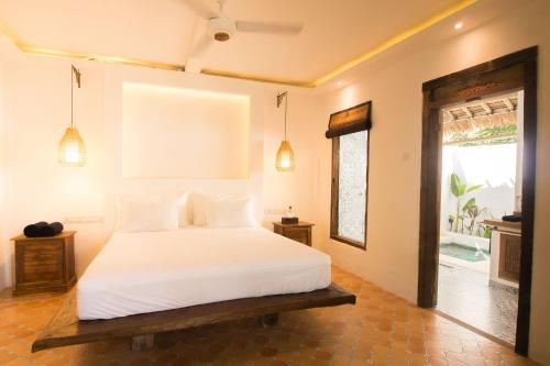 Кровать или кровати в номере The Mandana Villa Gili Air
