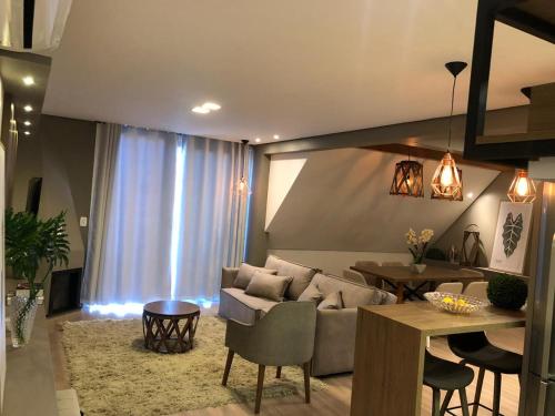 Zona de estar de Apartamento Cobertura Conceito Gramado