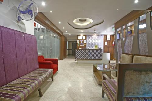 Predel za sedenje v nastanitvi Hotel Emerald