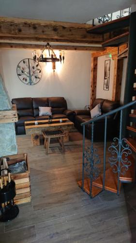 a living room with a couch and a table at Plitvički San in Korenica