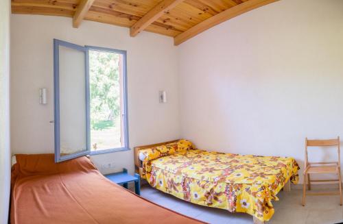 Postel nebo postele na pokoji v ubytování Résidence Marina di Capitello