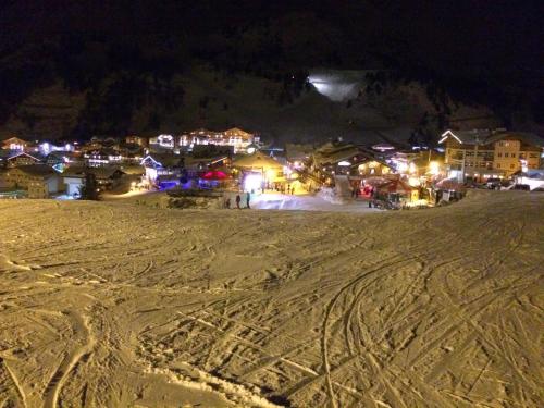 a night view of a town in the snow at Haus Bayliss in Zederhaus