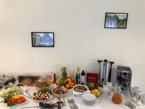 a kitchen counter with fruits and vegetables on it at Villa Anzio in Mariánské Lázně