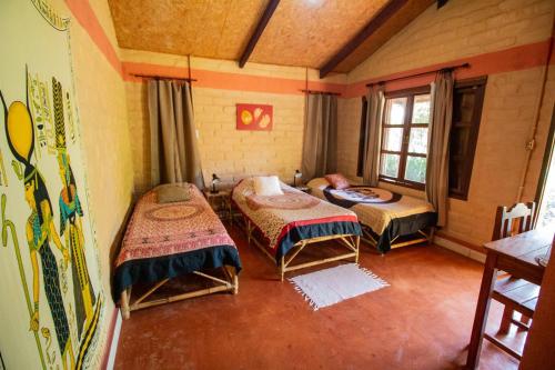 Un pat sau paturi într-o cameră la Pousada Aruana