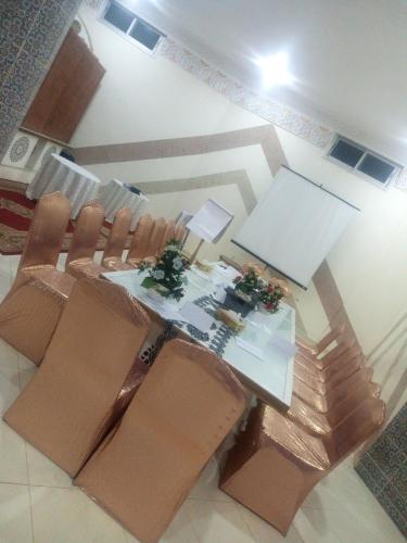 an overhead view of a dining room with a table and chairs at reda land in O Ben Slimane