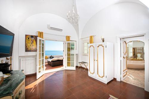 a living room with a view of the ocean at La Casa di Peppe in Positano
