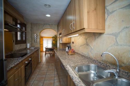 a kitchen with a sink and a counter top at Marquesa de las Jarras in Teruel