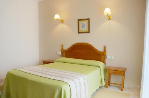 Posteľ alebo postele v izbe v ubytovaní Hotel Casa Portuguesa