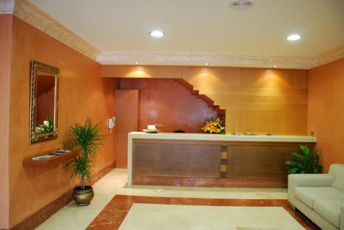 a lobby with a reception desk in a building at Hotel Casa Portuguesa in Meaño