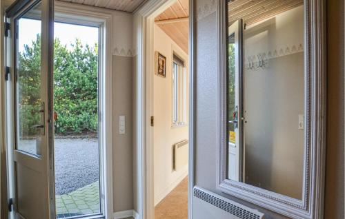 a door leading to aoyer with a glass door at Pet Friendly Home In Ansager With Sauna in Ansager