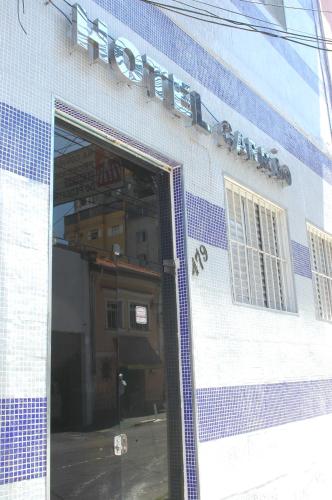 a door to a building with a sign on it at Hotel Carrão in Sao Paulo