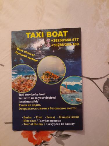 a sign for a taxi boat on a wall at Apartments Dragan in Kotor