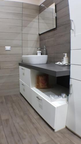 a bathroom with a sink and a counter with a drawer at B&B Ammore in Castellammare di Stabia