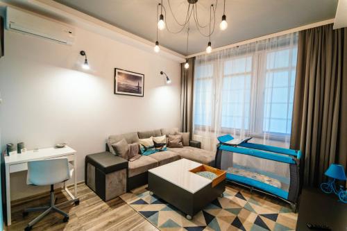 Χώρος καθιστικού στο MNE Apartament