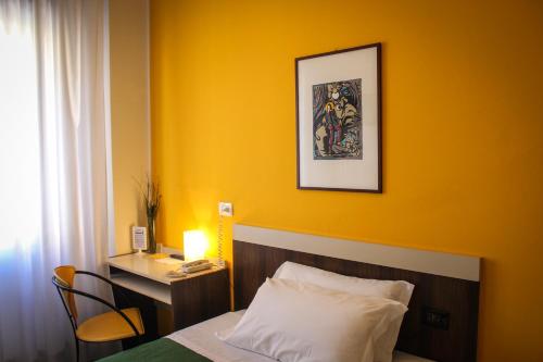 Postel nebo postele na pokoji v ubytování Hotel Centrale