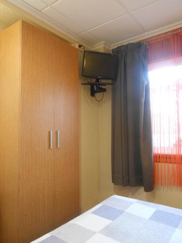 Katil atau katil-katil dalam bilik di Hostal El Callejón