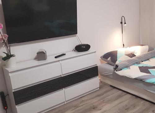 Letto o letti in una camera di Apartament RODZINNY Wałowa Wejherowo