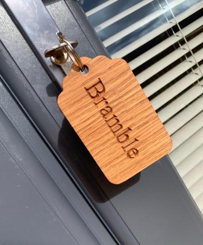 a wooden tag hanging on a car trunk at Daviot Luxury Pods in Inverness