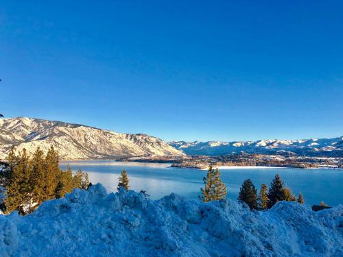 a view of a lake with snow covered mountains at Lakeside Lodge and Suites in Chelan