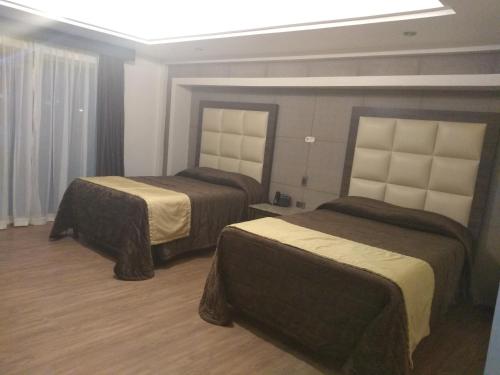 Cama o camas de una habitación en Hotel Jiménez Plaza