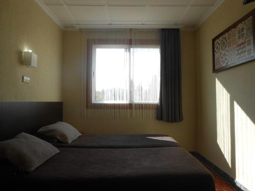 Katil atau katil-katil dalam bilik di Hostal El Callejón