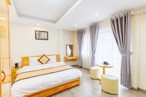 Postel nebo postele na pokoji v ubytování The Grace Hotel