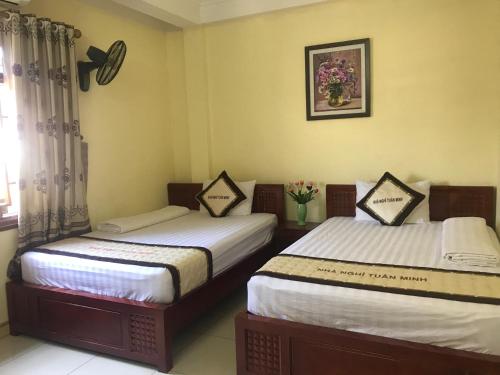
A bed or beds in a room at Tuan Minh Guest House
