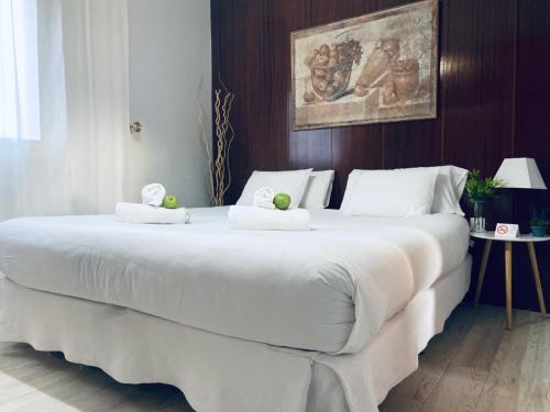 Un pat sau paturi într-o cameră la Apartamento Victoria