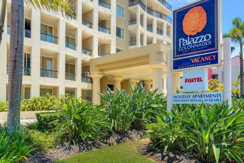 a hotel building with a sign in front of it at Palazzo Colonnades in Gold Coast