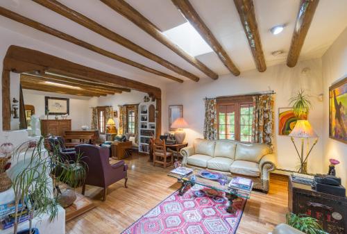 a living room with a couch and a table at Inn on La Loma Plaza in Taos