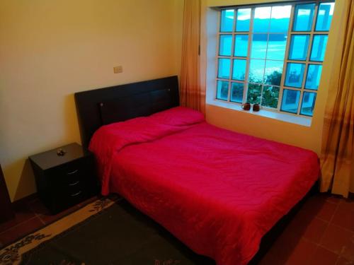 Ένα ή περισσότερα κρεβάτια σε δωμάτιο στο Villa Paola del Lago