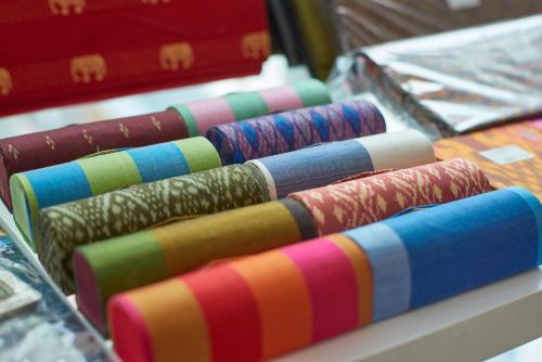 a row of different colored ties on a table at Phnom Penh Katari Hotel in Phnom Penh