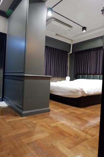 a room with a bed and a desk in a room at bangkok bed place in Bangkok