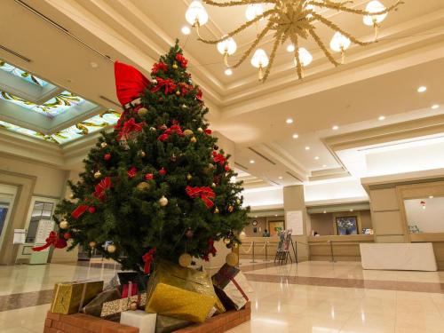 a christmas tree in the lobby of a building at Hotel Listel Inawashiro Wing Tower in Inawashiro