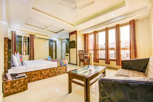 a hotel room with a bed and a couch at Via CT Palace in Bhopal