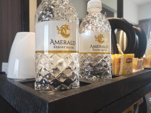 two bottles of water sitting on a shelf at AMERALD RESORT HOTEL DESARU in Pengerang