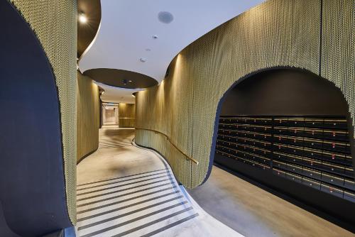 a hallway with an archway in a building at Mega Style Apartments Opus in Melbourne