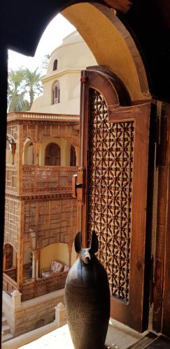 a black vase sitting in front of a building at Djorff Palace in Luxor